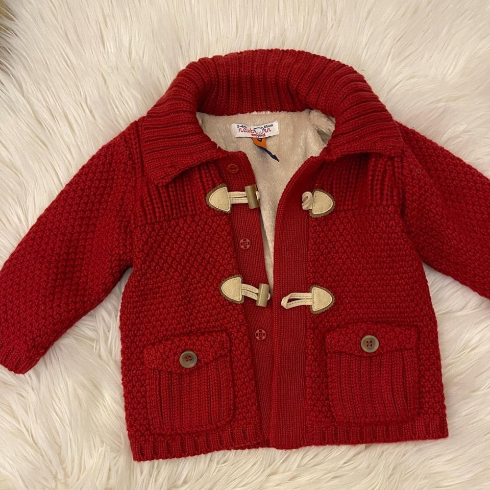 Red baby coat with lining on the inside